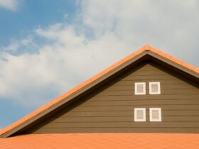 Orange and Gray Painted Roof Under Cloudy