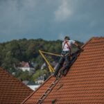 Roofers repairing roof