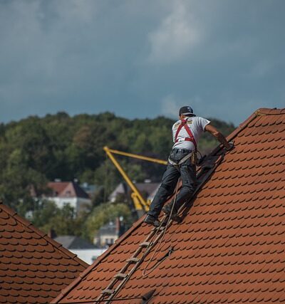 Roofers repairing roof