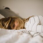 woman lying on bed