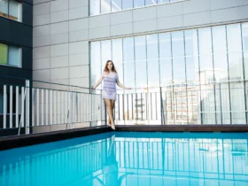 woman posing outdoor in summer in hot weather on pool