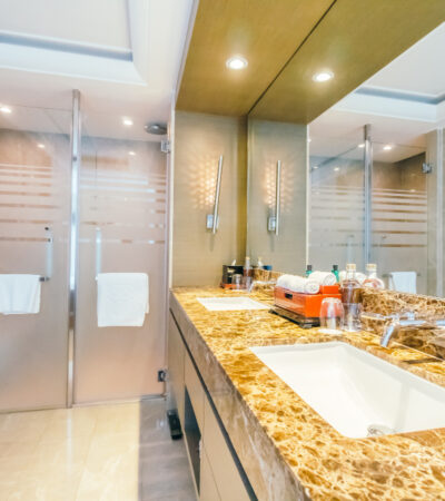 Tidy bathroom with shiny tiles