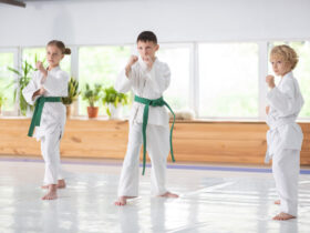 active boys and girl feeling serious while studying martial art