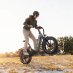 The boy is riding an e-bike