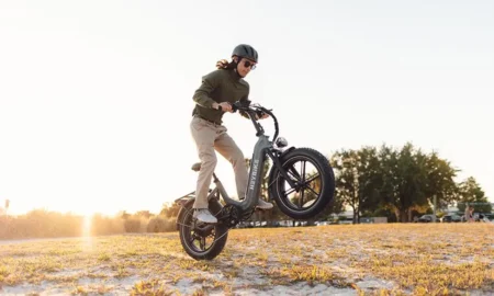 The boy is riding an e-bike