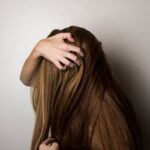 Woman Covering Face with Her Hair