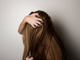 Woman Covering Face with Her Hair