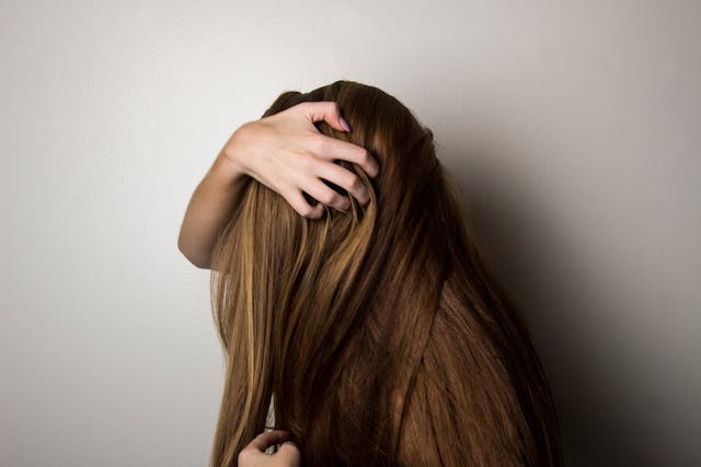 Woman Covering Face with Her Hair