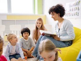 Woman Reading A Book To The Children