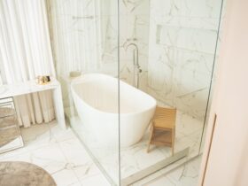 a bathroom with a tub and stool