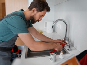 man working as plumber