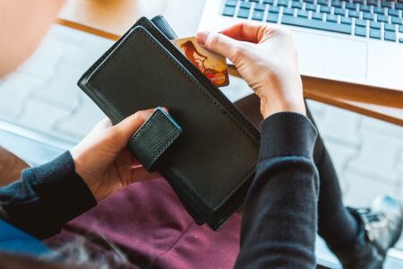 A lady holding her mastrcard